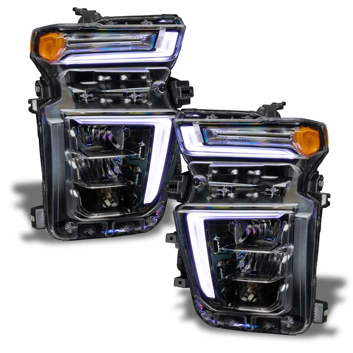 Chevrolet Silverado headlights with white DRLs.