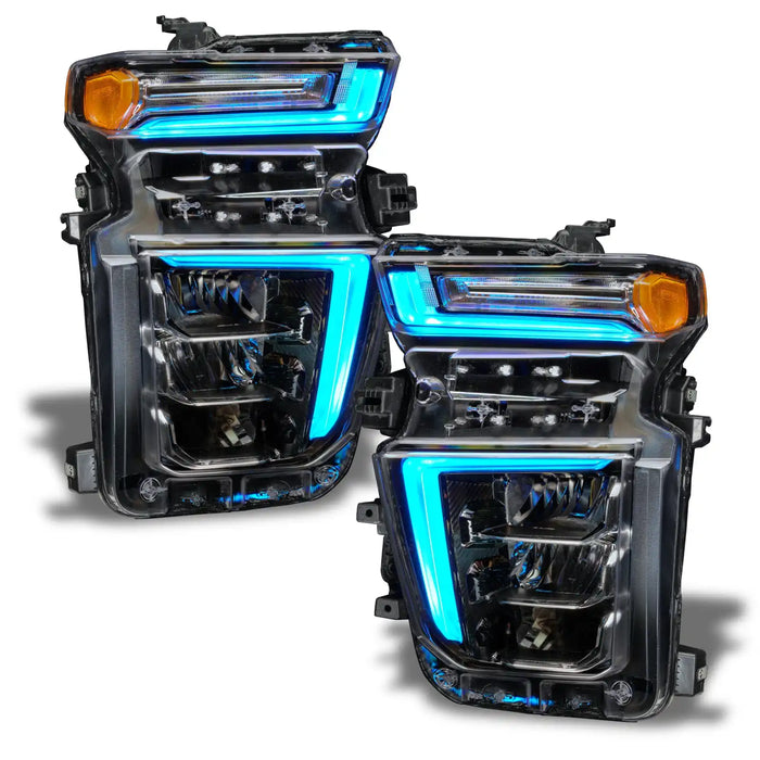 Chevrolet Silverado headlights with cyan DRLs.