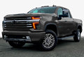 Three quarters view of a Chevy Silverado with amber headlight DRLs.