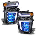 Chevrolet Silverado headlights with cyan demon eye projector.