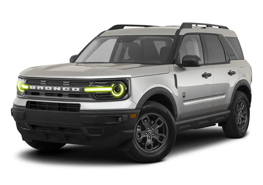 Three quarters view of a Ford Bronco Sport with yellow headlight halos and DRLs.