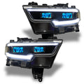 Ram 1500 headlights with cyan demon eye projectors.