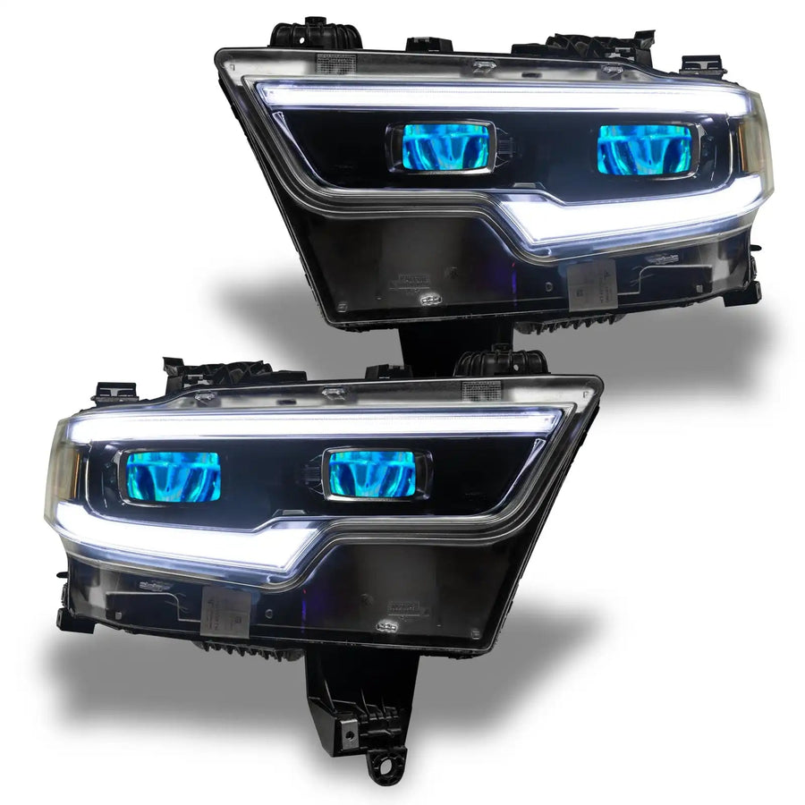 Ram 1500 headlights with cyan demon eye projectors.