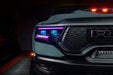 Close-up of a Ram 1500 headlight with purple DRLs and cyan demon eye projectors.