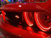 Close-up of red dodge challenger with red halo headlights