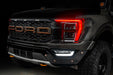 Front end of a Ford F-150 with red headlight DRLs