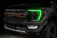 Front end of a Ford F-150 with green headlight DRLs