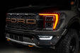 Front end of a Ford F-150 with amber headlight DRLs