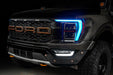 Front end of a Ford F-150 with cyan headlight DRLs