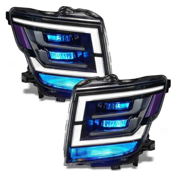 2021-2024 Nissan Titan headlights with cyan demon eye projectors.