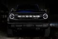 Front view of a Ford Bronco with white halo headlights.