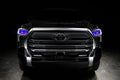  Straight front view of a black Toyota Tundra with purple demon eye projectors.