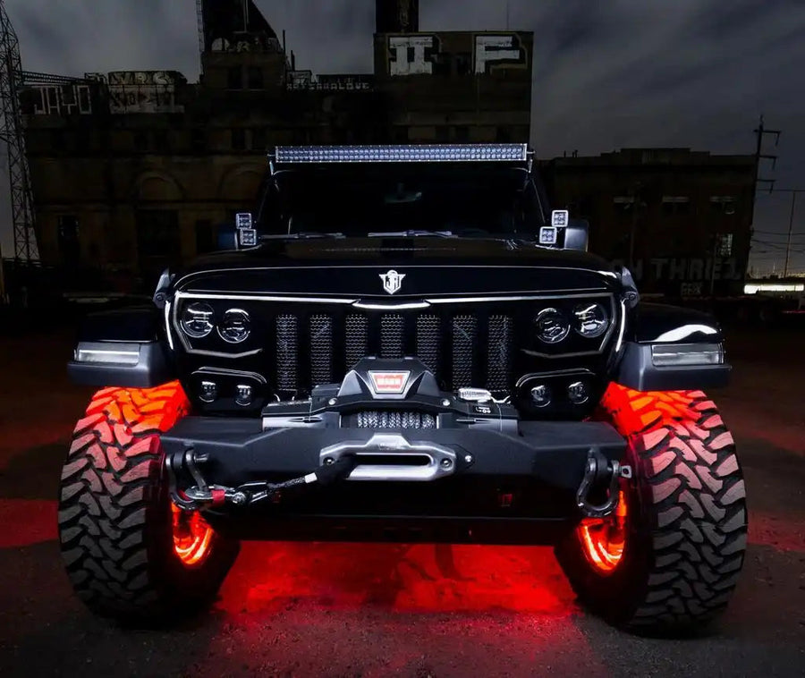 Front end of a Jeep with Upper Windshield Brackets and Light Combo installed.