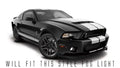 Three quarters view of a Ford Mustang with white LED fog light halo rings.