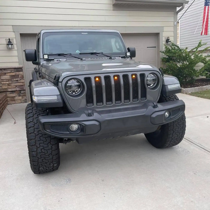 Front end of a Jeep Wrangler with amber LED Grill Light Kit installed.
