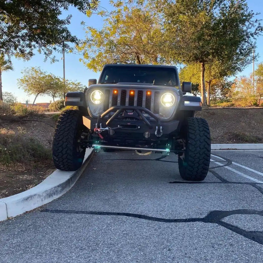 Front end of a Jeep Wrangler with amber LED Grill Light Kit installed.