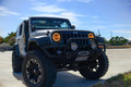 Three quarters view of a Jeep Wrangler JK with amber LED headlight halos installed.