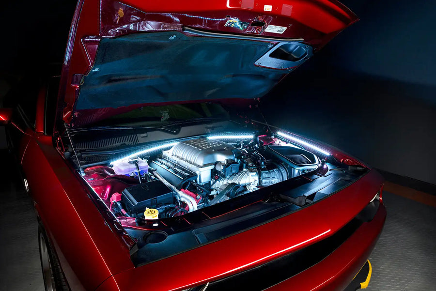 Red Challenger with white engine bay lighting.