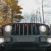 Front end of a Jeep Wrangler with amber LED Grill Light Kit.