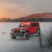 Three quarters view of a red Jeep Wrangler with amber LED Grill Light Kit.