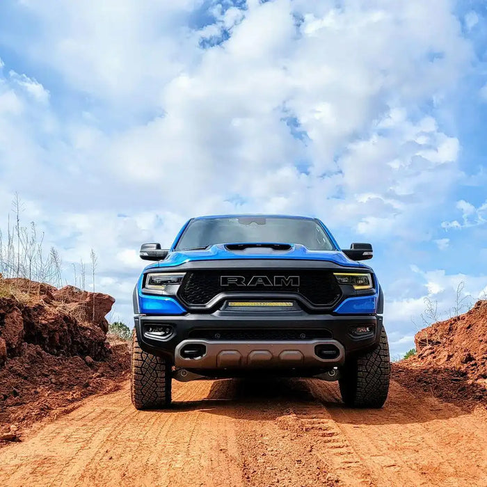 Front view of a blue RAM TRX with yellow LED Front Bumper Flush LED Light Bar System