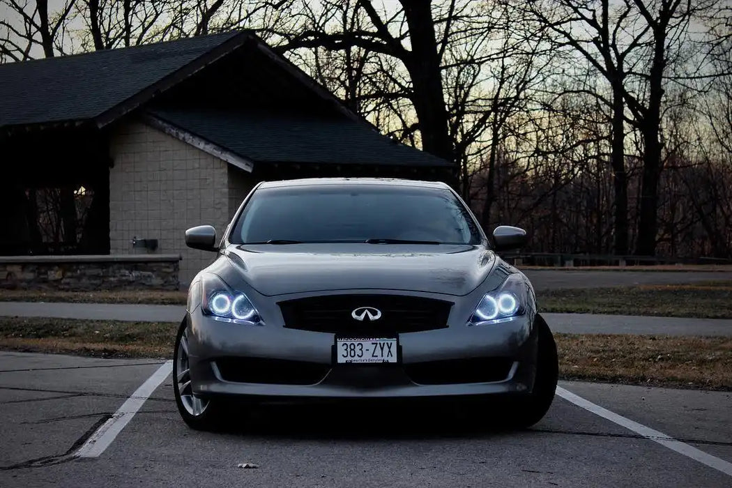 Front end of an Infiniti G37 with white LED headlight halos installed.