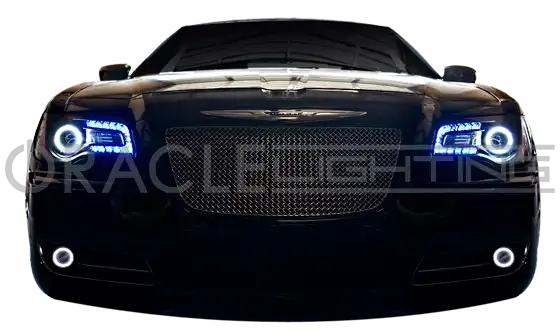 Front end of a Chrysler with white LED headlight and fog light halo rings installed.
