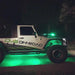Side view of a Jeep with green LED rock lights.