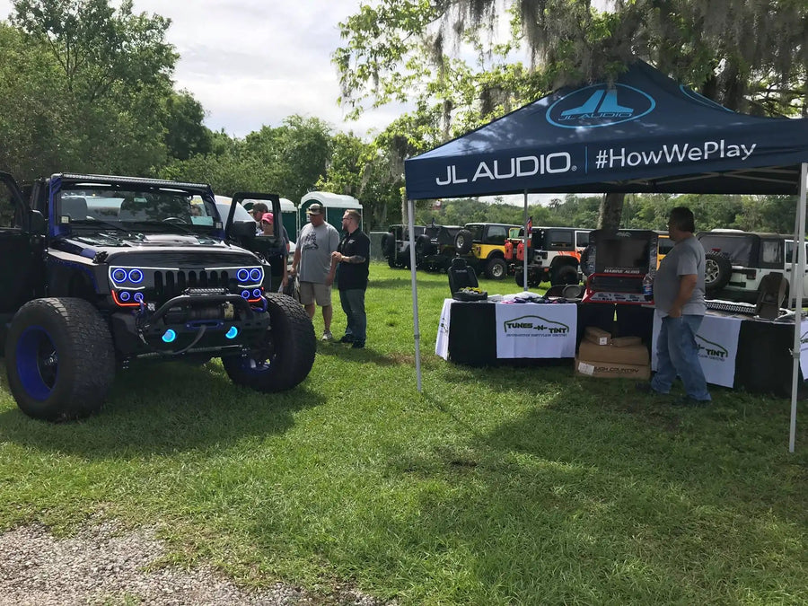 Jeep Wrangler at a car meet with Vector Series Grill LED Halo Kit installed.
