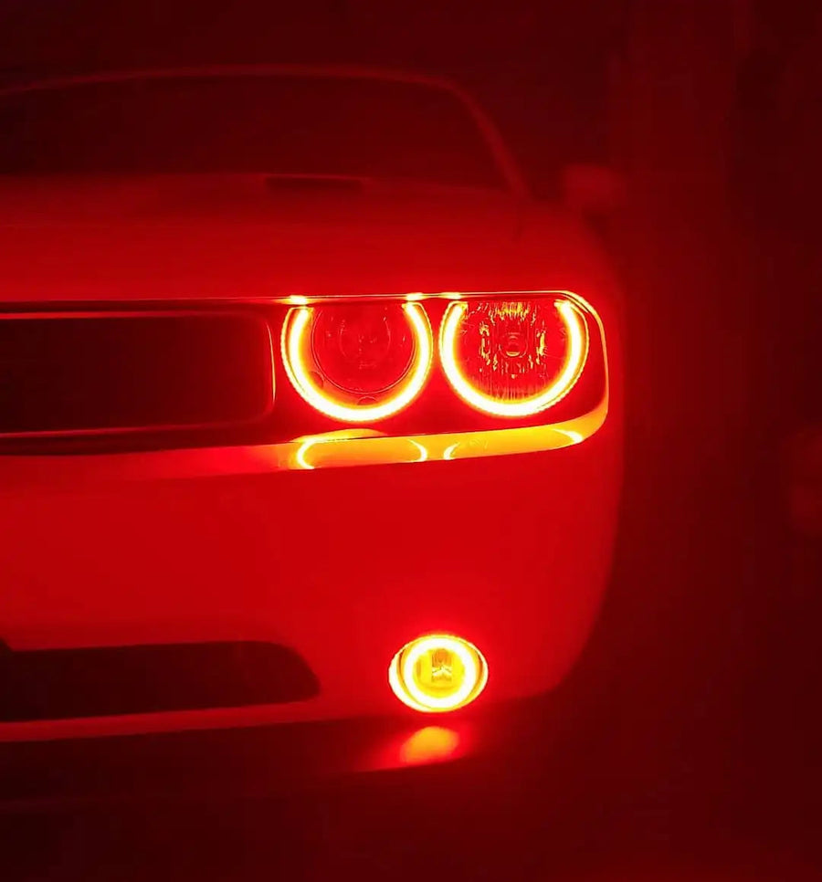 Close-up of challenger headlights with red halos