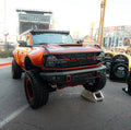 Cambered Customs Ford Bronco at a car show, equipped with LED Off-Road Side Mirrors and Magnet Covers.