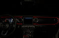 The dashboard of a Jeep with ColorSHIFT Fiber Optic LED Interior Kit installed, glowing red.
