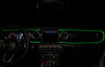 The dashboard of a Jeep with ColorSHIFT Fiber Optic LED Interior Kit installed, glowing green.