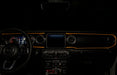 The dashboard of a Jeep with ColorSHIFT Fiber Optic LED Interior Kit installed, glowing amber.