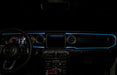 The dashboard of a Jeep with ColorSHIFT Fiber Optic LED Interior Kit installed, glowing cyan.