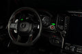 Drivers side seat of a RAM TRX with green LED ambient lighting.