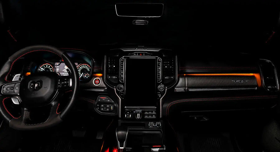 View of a RAM TRX dashboard from the backseat with amber LED ambient lighting kit.
