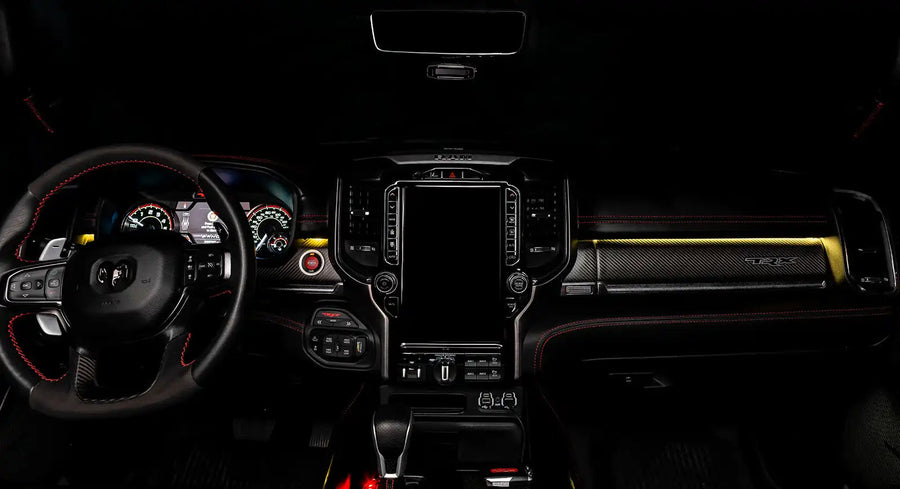 View of a RAM TRX dashboard from the backseat with yellow LED ambient lighting kit.