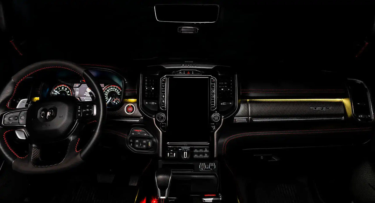 View of a RAM TRX dashboard from the backseat with yellow LED ambient lighting kit.