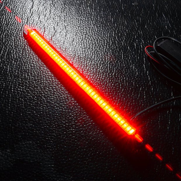 Linear Universal LED 3rd Brake Light (CHMSL) Module - Red displayed on a textured surface, highlighting its bright red blade design.