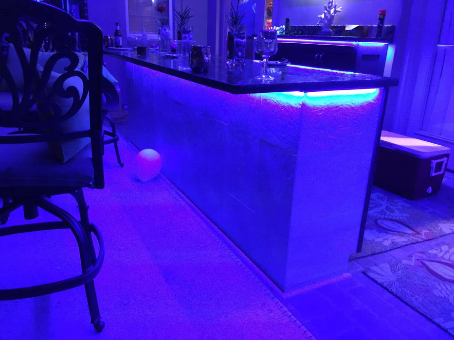 Home bar with LED accent lighting beneath the counter