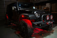 Black Jeep with red LED rock lights installed.