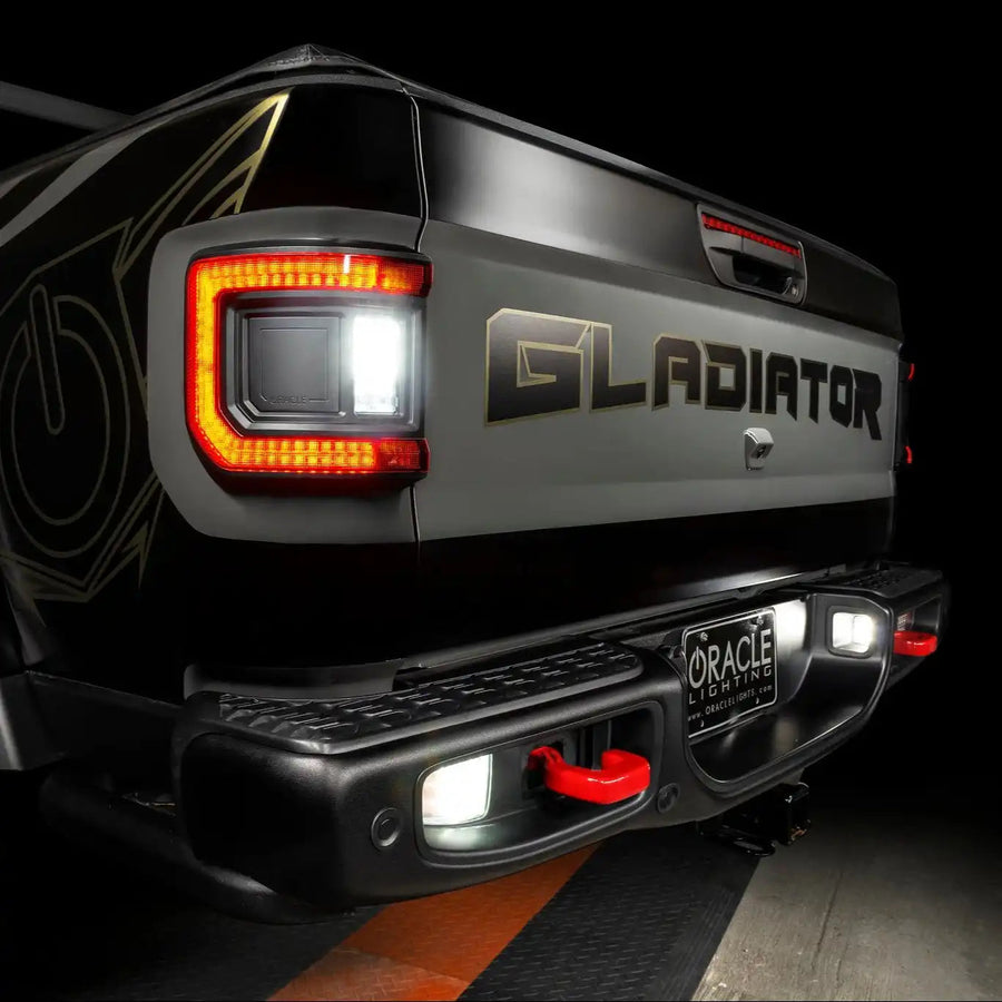 Close-up on the rear end of a Jeep Gladiator with reverse lights on.