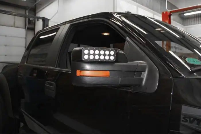 Close-up of a LED Off-Road Side Mirror installed on a Ford F-150.