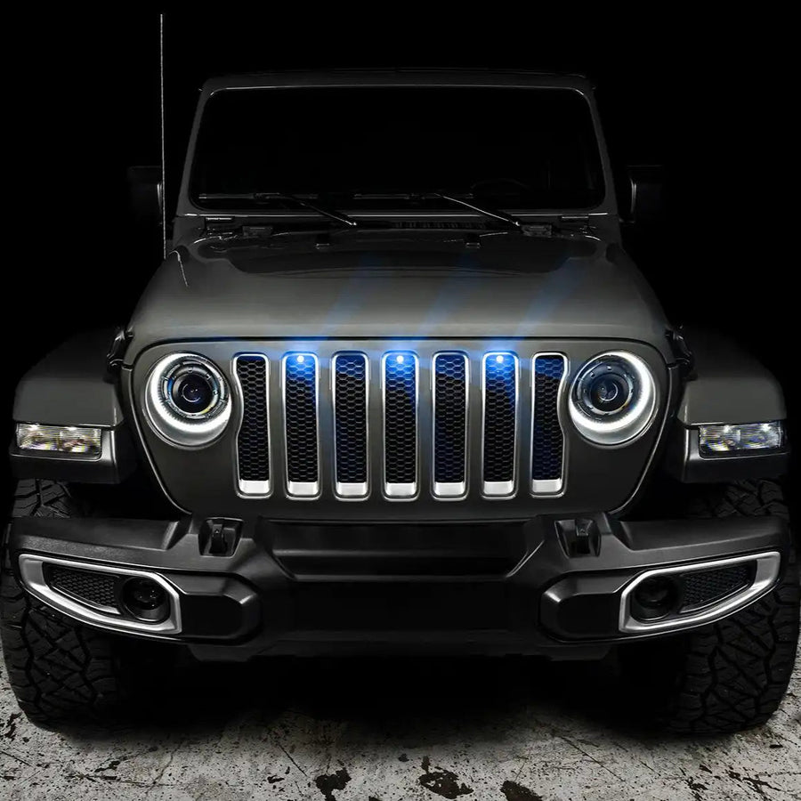 Front end of a Jeep Wrangler with blue LED Grill Light Kit installed.