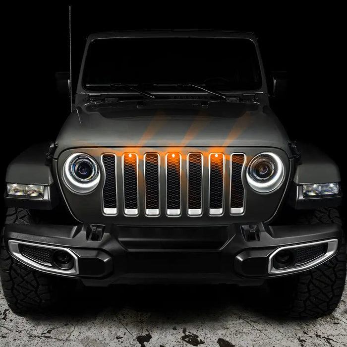 Front end of a Jeep Wrangler with amber LED Grill Light Kit.