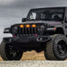 Three quarters view of a black Jeep Gladiator with amber Pre-Runner Style LED Grill Light Kit installed.