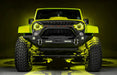 Front view of a yellow Jeep with 7" Oculus Headlights installed, set to yellow LEDs.