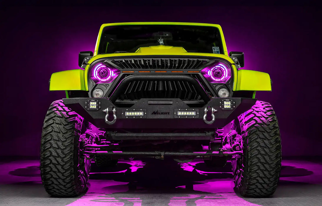 Front view of a yellow Jeep with 7" Oculus Headlights installed, set to pink LEDs.