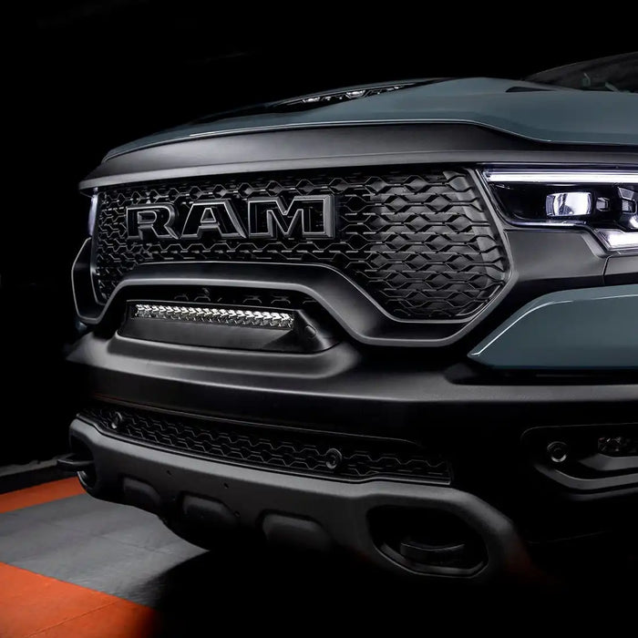 Front end of a RAM TRX with Front Bumper Flush LED Light Bar System installed with white LEDs.